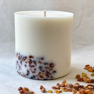 Eco friendly soy wax candle decorated with real pieces of golden Baltic amber and evokes the aroma of pine forest.